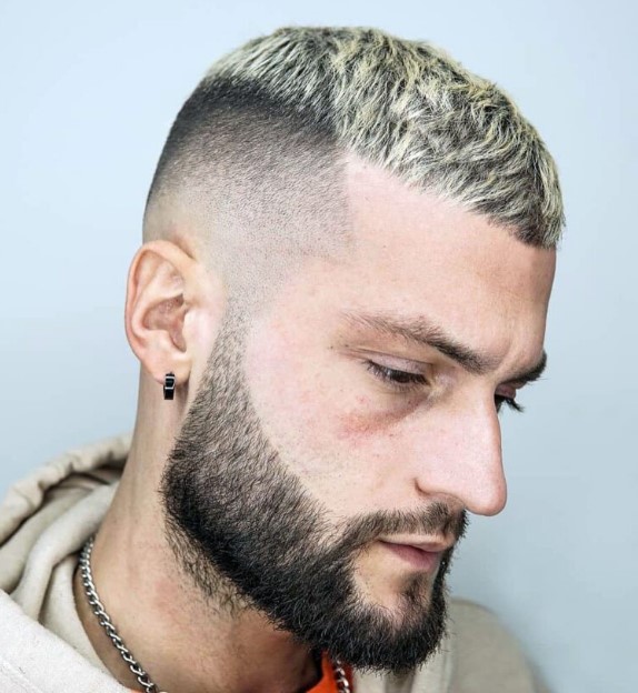 a bleached buzz cut with a faded temple and a beard looks edgy as only the top is bleached