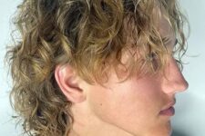 a blonde wavy wolf hairstyle is a lovely idea for summer, shag it, long and trim the sides down for more comfortable wearing