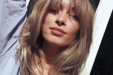 a bronde light bronde butterfly haircut with bottleneck bangs is a gorgeous idea to look 70s inspired