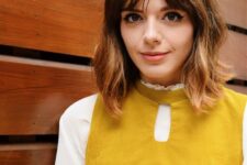 a brown long bob with bottleneck bangs and messy waves is a cool and pretty solution