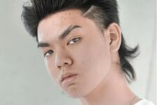 a brushed up wolf haircut with faded sides is a bold and catchy idea if you are ready for styling