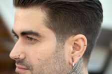 a combed back taper haircut with slick 80s revived look, with slightly shorter side hair is a cool idea