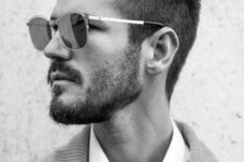 a coned brush up with an undercut beard is a cool example to look chic and bold, the sides are tapered