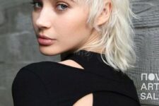 a cool and shaggy icy blonde mullet with fringe and bottleneck bangs is a very chic and cool idea