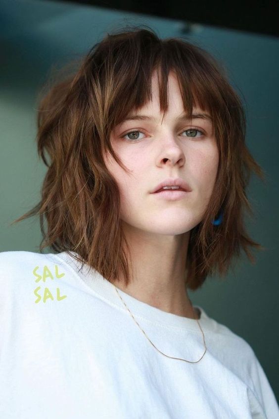 a cool shaggy long bob with bottleneck bangs and messy waves is a very cool and edgy solution