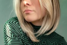 a fair long bob with a blonde layered money piece and middle part is a stylish and modern solution