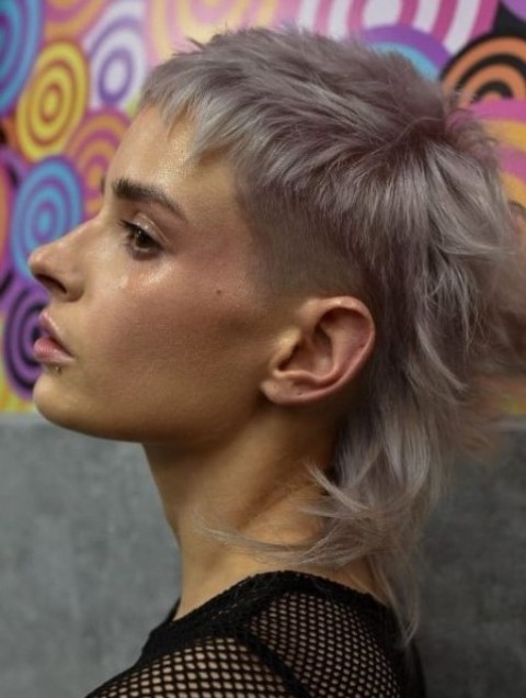 a grey-colored mullet with a fade to the sides of the hair to give it structure and create a slight contrast