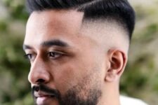 a high fade combover is a versatile haircut, with the top left longer to provide more volume, the beard adds to the style