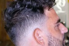 a long curly top with a low bald fade looks maculine, especially paired with a stylish beard