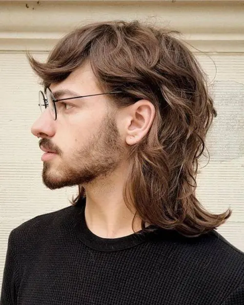 a lovely brown wolf cut with wavy texture and long bangs is a cool idea for a relaxed and cool look