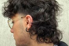 a messy wolf cut with skin fade and curls is a cool idea, you may keep your curls behind your ear and it won’t be in sight