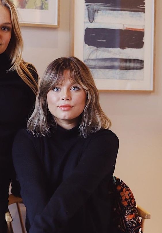 a mousy grey outgrown bob with bottleneck bangs is a cool idea if you want that effortlessly chic vibe