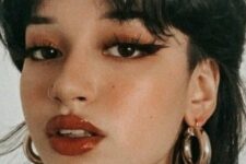 a mullet with bangs like here can be used to soften the cut or to emphasize the disconnection