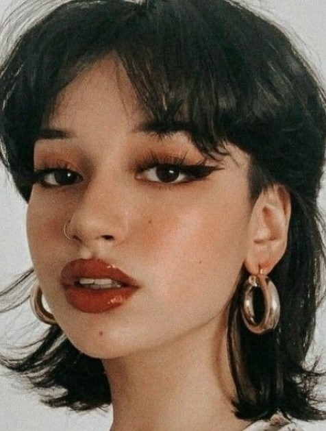 a mullet with bangs like here can be used to soften the cut or to emphasize the disconnection