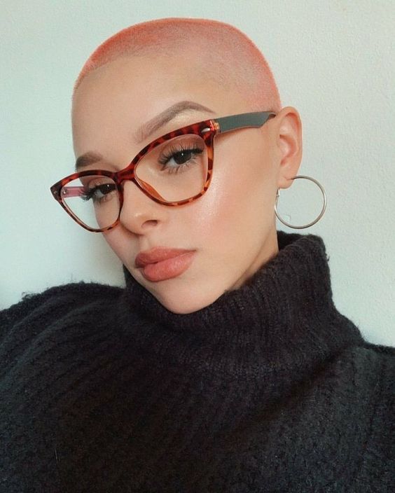 a peachy pink short buzz cut with fade is a lovely idea if you wanna make a statement with color