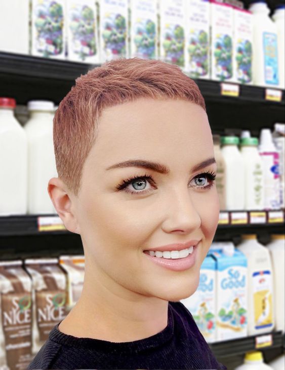 a pink buzz cut with a longer top and shorter sides shows off the texture and thickness of the hair