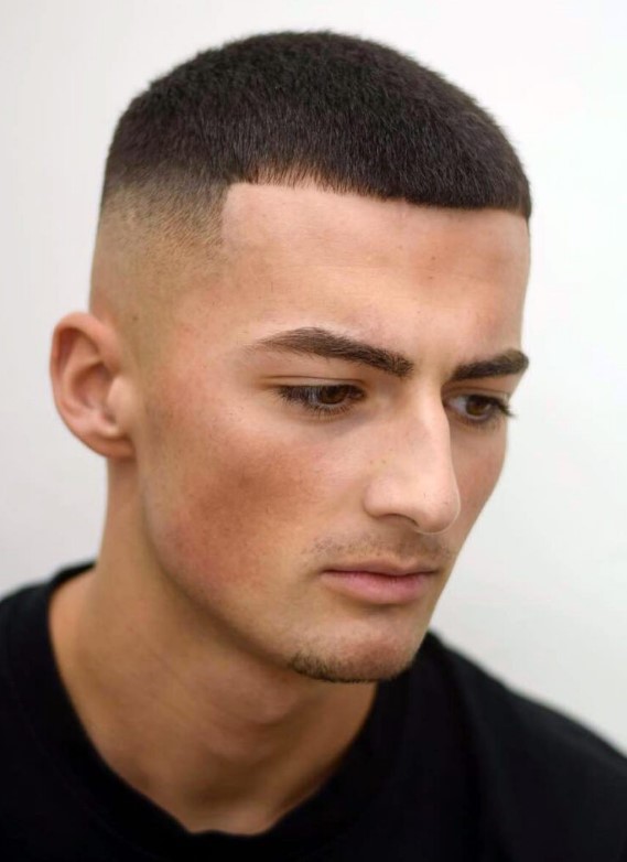a pitch perfect buzz cut with a faded temple and tapered line ups is a stylish solution