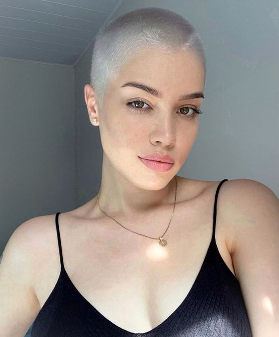 a platinum blonde buzz cut looks very chic and delicate and highlights your features in a subtle way