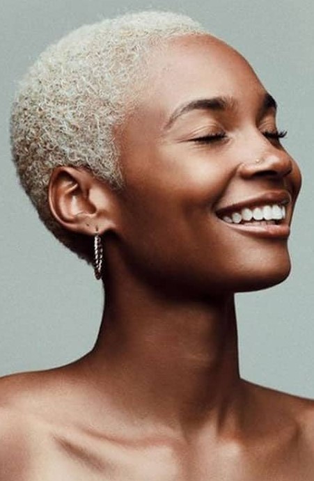 a platinum blonde buzz cut on naturally curly hair is a lovely idea that shows off your texture and color