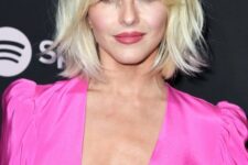 a shaggy blonde long bob with bottleneck bangs and a darker root is a chic and catchy idea