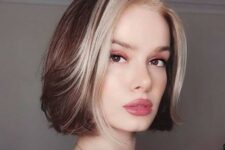 a short bold brunette bob with icy blonde money piece is a gorgeous idea for a bold look