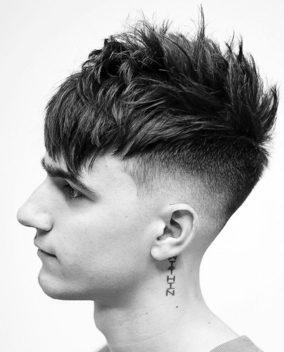 a thin hair undercut fade with an angular fringe will unleash a punk star in you, get a longer top