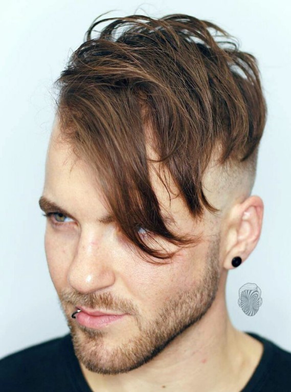 an angular fade with double disconnected bald fade and angular fringe requires some styling with hair spray