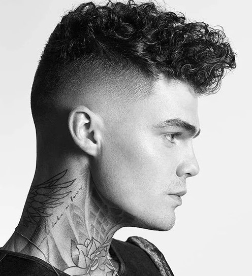 dimensional and messy curly hair with a high undercut fade will look great and catchy, contrasting