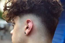 long curly hair with a low drop fade is a cool and lovely way to embrace your texture and look trendy
