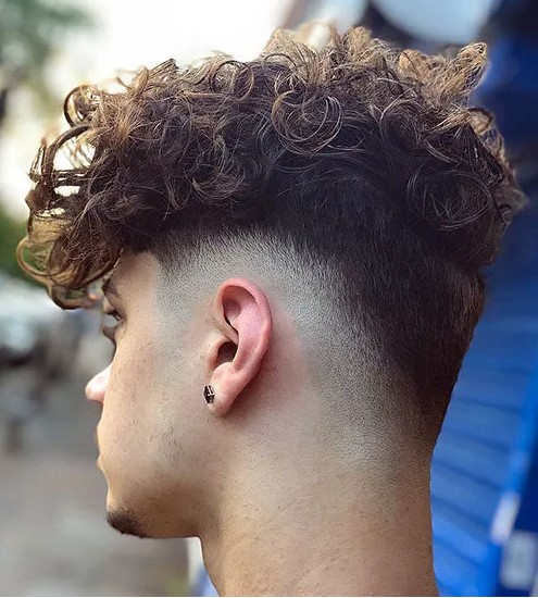 long curly hair with a low drop fade is a cool and lovely way to embrace your texture and look trendy