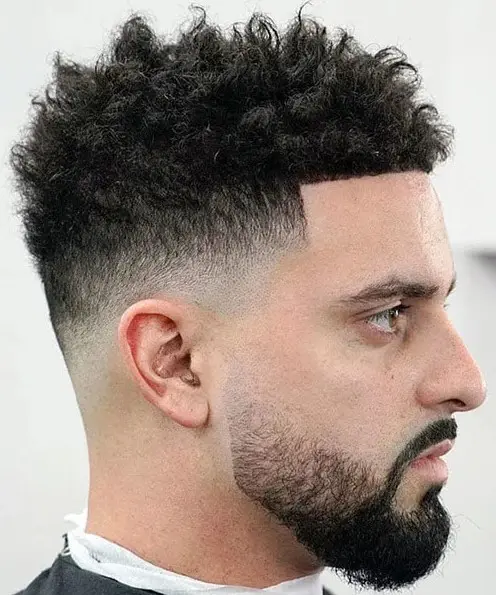 messy curls up, low fade and shape up are a modern option for guys to show off the texture of the hair