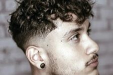 messy curly hair with a tape fade is a creative take on classics, and you can style it with a blow dryer