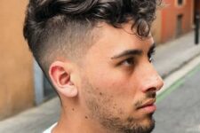 tousled curls with a high undercut fade look effortlessly chic and cool and will show off the texture of your hair