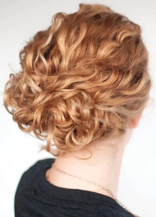 a beautiful and easy curly updo with a curly top and a beautiful ginger shade is a cool idea for a wedding