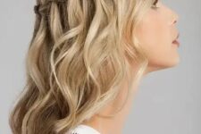02 a blonde medium length half updo with a braided top and waves down is a stylish boho wedding idea