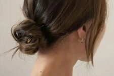 07 a chic and cool messy low bun with a bump on top and face-framing locks is a cool hairstyle for medium hair