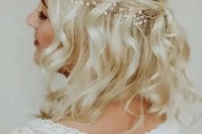 09 a half updo with a halo braid and waves accented with a hair vine for a boho bride or bridesmaid