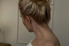 10 a classic messy and wavy top knot, messy and wavy hair are a fresh and modern idea for a modern mother of the bride or groom look