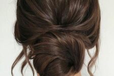 11 a classic twisted low bun with a volume on top and some face-framing hair is a catchy and stylish idea