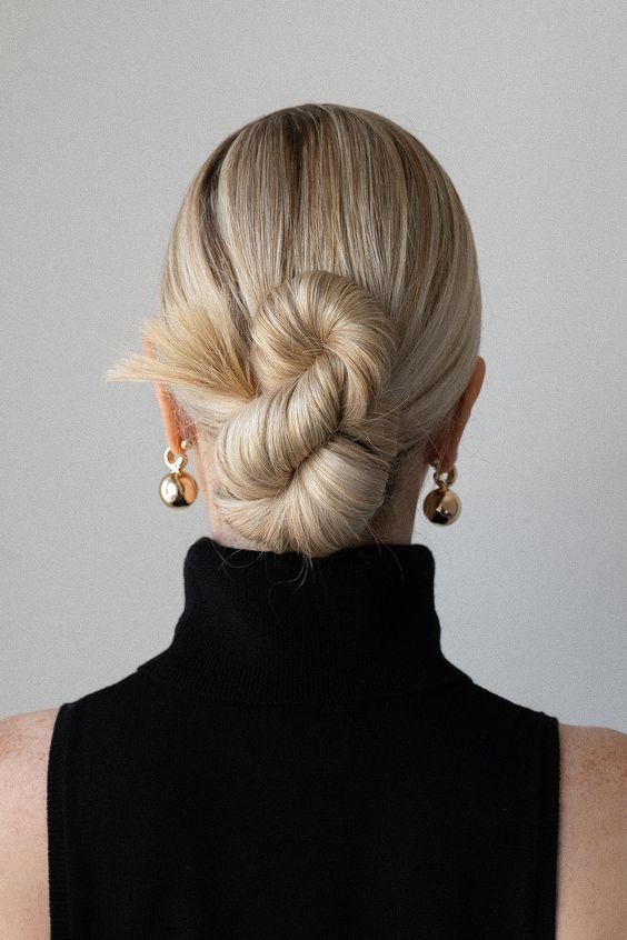 a creative twisted 8 low bun with a sleek top is a cool idea, this is a fresh take on a classic low bun, it's perfect for long hair