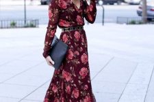 13 a burgundy floral maxi dress with long sleeves, V-neckline, a belt, nude shoes and a clutch