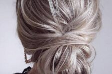 14 a messy low bun with a volume on top is a cool idea if you are looking for an updo but a more casual one