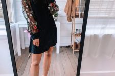 15 a catchy black mini dress with a high neckline, floral sleeves, black spiked shoes are a cool combo for a fall or winter wedding