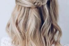 15 a pretty wedding half updo with a twisted and braided halo and waves down is ideal for medium length hair