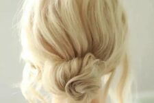 17 a messy twisted low bun with a messy bump on top and some locks down is a chic and cool idea if your style isn’t too formal