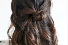 18 a simple half updo with a textured top, waves down and a bun is a cool idea for a bridesmaid
