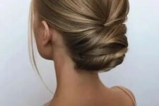 18 a sophisticated modern twisted updo with a sleek yet dimensional top and a bit of locks to frame the face is a great idea for a formal wedding