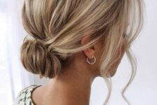 19 a pretty loose low bun with a bump on top and some locks framing the face is a stylish idea for a bridesmaid