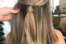 19 a stylish and cool half updo with a wrapped ponytail on top and straight hair down is a non-typical and very modern solution