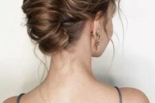 21 a chingon updo with a messy and wavy top plus some waves down is a cool idea for a modern and refined look